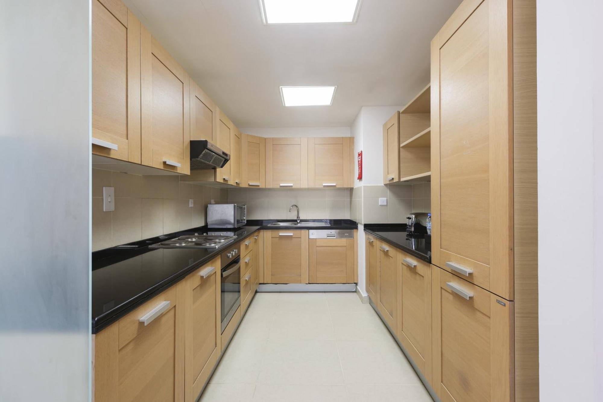 Nassima Tower Hotel Apartments Dubai Exterior foto A typical kitchen in a residential hall